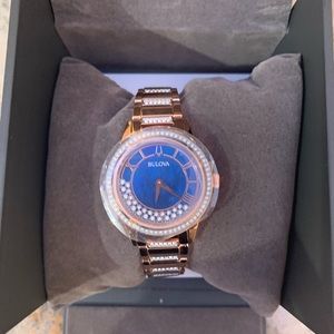 Bulova gold watch with pendulum quartz diamonds